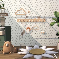 there is a teddy bear sitting on the floor next to a potted plant and other items