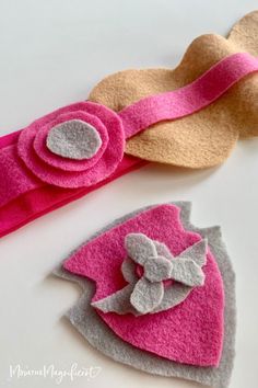 two felt hair clips with bows on them