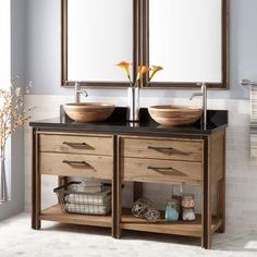 two sinks with mirrors above them in a bathroom