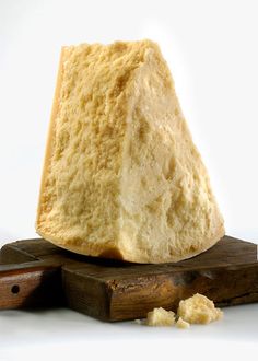 a piece of bread sitting on top of a wooden block