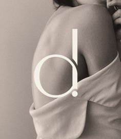 a woman in a white dress with the letter o on her back