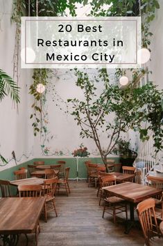 a restaurant with wooden tables and chairs in front of a green wall that reads 20 best restaurants in mexico city