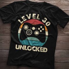 a t - shirt that says level it unlocked on the front, and an image of a