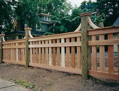 a wooden fence in front of a house