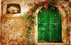 a green door with pink flowers on it and a quote from the book don't be afraid to follow your bliss and doors will open where you didn't know they were going in