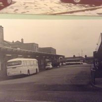 an old and new photo of cars parked on the street