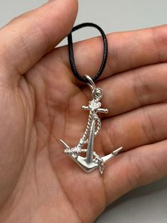 Stunning Anchor wrapped with rope. Jewelry for lovers of the ocean and sea life. A perfect father's gift. This is a unique work done all by the sea passionate artist, design, production, and finish. This pendant is included with a black waxed cord necklace(18in.) **Note: Pictures are enlarged to show detail. All pendants are packaged and shipped in a cotton baggy inside a water and tear-resistant bubble wrap envelope. If you have any questions about this item or any other items listed in our shop please do not hesitate to contact us.** Made out of .925 Sterling Silver. Completely solid and light. Recommend for adults and teens. MADE IN USA Copyright belonging to Lluch Art Design. Rope Jewelry, Note Pictures, Anchor Necklace, Cord Necklace, For Lovers, By The Sea, Sea Life, Bubble Wrap, Gifts For Father