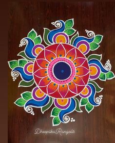 an intricately decorated wooden surface with flowers and leaves painted on it