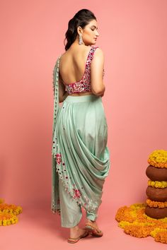 Mint green dhoti style pre-draped saree in floral mirror work embroidery. Paired with mirror work blouse.
Components:2
Pattern:Embroidered
Type of Work:Mirror work, Mukaish work
Neckline:Square
Sleeve Length:Sleeveless
Fabric:Raw silk, Georgette
Color:Green
Other Details:
Shell and bead tassel saree
Note: Please get in touch with our customer care service to customize the colour
Occasion:Reception,Sangeet - Aza Fashions Tassel Saree, Mukaish Work, Dhoti Saree, Draped Saree, Mirror Work Blouse, Floral Mirror, Drape Saree, Blouse For Women, Fashion App