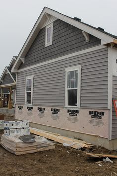 a house being built in the process of being remodeled with new windows and sidings