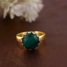 Malachite Gemstone Ring, Statement Ring, 18k gold plated Ring, handmade Ring, silver plated Ring, Boho Ring, Mother Gift, Dainty ring  Enjoy Free Shipping on All Orders *Handmade item *Dispatches from a small business in India *Materials         :-   Brass, 925 sterling Silver *Band colour    :-   Gold, Silver *Style                 :-   Boho & hippie *Can be personalized Product Description:-  PRODUCT CODE     :-  SIZE           :-    All Size Are Available. Choose From Variation. METAL           :-    Brass, 925 sterling silver STONE                    :-    malachite  STONE SHAPE        :-    Round Ring can be customized on request and gemstone can be made to any gemstone you want. If You Need Faster Shipping, Please Contact us Please Make Sure to Include The Correct Address During Befo Gold Spiritual Rings With Bezel Setting, Spiritual Gold Rings With Bezel Setting, Gold-colored Sterling Silver Crystal Ring, Gold Crystal Ring In Sterling Silver, Round Shape, Gold Plated May Birthstone Ring, Brass Jewelry With Bezel Setting For Gift, Brass Round Band Jewelry Gift, Yellow Gold Rings With Natural Stones, Spiritual Yellow Gold Round Crystal Ring