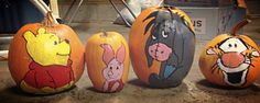 three pumpkins with winnie the pooh characters painted on them