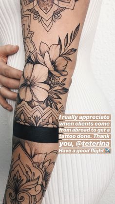 a woman's arm with flowers on it, and the words really appreciate when clings come from around to get a tattoo