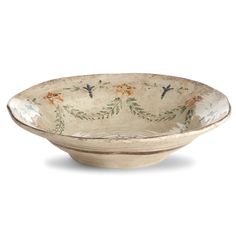 a white bowl with floral designs on it