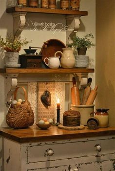 an old dresser is filled with dishes and cooking utensils on top of it