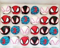 spiderman cupcakes are arranged in a box