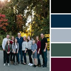 a group of people standing next to each other in front of trees with the sun behind them