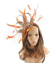 Gorgoeus loops with coque feathers Body measures about 8 inches wide With orange headband Unsure about colour? We send can send free colour samples anywhere in the world. Simply email us with colours and address. Samples can take a week to 10 days so be sure to ask early. Do you need your hat or fascinator in a hurry? We can deliver your hat or fascinator in 3 days via UPS to USA for $45 dollars via UPS and is a guaranteed service within 3 days. If you live in Australia, New Zealand or Asia, cos Cocktail Garden Party, Orange Fascinators, Red Fascinator, Kentucky Derby Fascinator, Derby Outfits, Eggplant Purple, Derby Party, Wedding Cocktails, Fascinator Hats