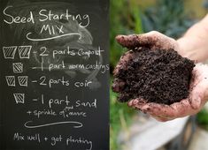 a person holding soil in their hands next to a chalkboard with seed starting mix written on it