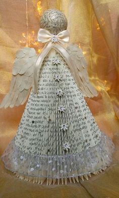 an origami angel made out of book pages