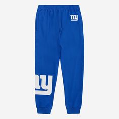 It's time to get stylish while you absolutely crush that workout. Flex your fandom in these New York Giants Team Color Joggers. Features All-over, team-colored design so you can rep the team in style Team logo display on upper left leg, in case there were any doubts where your allegiances lie Bold team logo display on right leg so you can show off your team pride with every stride Elastic waistband to keep you comfortable Details Material: 65% Cotton/35% Polyester Officially licensed Imported Logo Display, New York Giants, Team Colors, Team Logo, Sweatpants, New York, Elastic, ? Logo, Pants