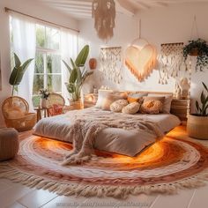 a large bed sitting inside of a bedroom on top of a white floor next to potted plants