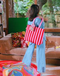 Includes: 1 Cotton Embroidered Tote Bag with Magnetic Closure⁣⁣Size: 14” x 20"⁣⁣⁣⁣⁣⁣⁣⁣Certifications: OEKO-TEX® | Fair Trade USA | BCI⁣⁣⁣⁣• 100% Organic Cotton Tote Bag with Cotton Embroidery • Sustainably sourced• Magnetic closure• Interior pocket The Lovers Tote is the perfect bag for a variety of occasions! With its pink and red striped design, it exudes a sweet and casual vibe, making it ideal for a beach day, night out or even a short weekend trip. The plush, embroidered cotton fabric, simi Multicolor Embroidered Tote Bag For Vacation, Beach Tote Shoulder Bag With Multicolor Embroidery, Multicolor Embroidered Tote Beach Bag, Striped Woven Tote Bag, Multicolor Embroidered Tote Shoulder Bag, Cloth Tote Bag, Organic Cotton Bedding, Embroidered Throw Pillows, Embroidered Tote Bag