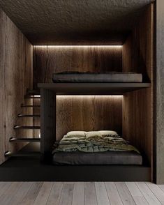 two bunk beds in a wooden room with stairs leading up to the top bed and bottom bed