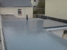 a flat roof in the middle of a residential area