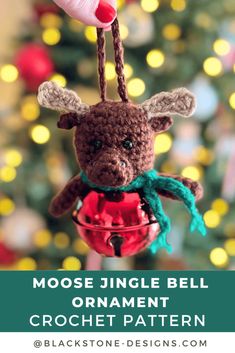 a crocheted moose ornament hanging from a christmas tree with text overlay that reads, moose jingle bell ornament crochet pattern