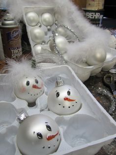 an assortment of christmas ornaments are displayed on a table