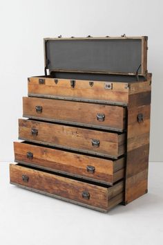 an old chest with five drawers and a chalkboard on top