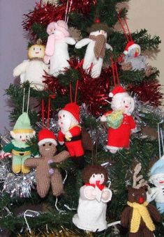 there are many stuffed animals hanging from the christmas tree