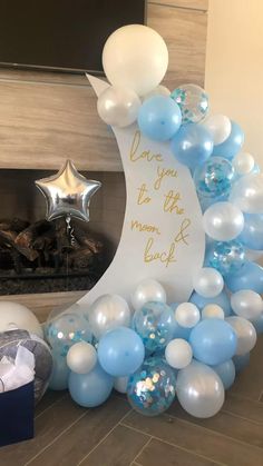 a balloon arch with blue and white balloons