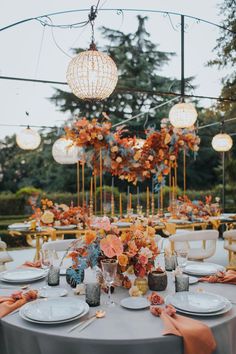 a table set with plates and place settings