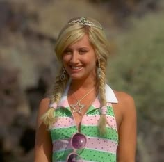 a woman in a green and white striped bathing suit