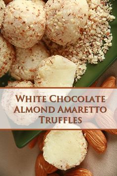 white chocolate almond amarjeto truffles on a green plate with almonds