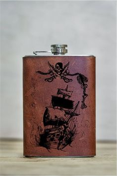 a flask with a pirate ship on it