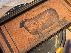 the sheep is painted on the door mat