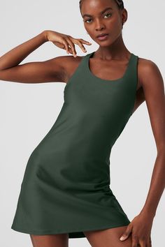 For tournament season and beyond, the Airlift Fly Dress is your secret weapon for a winning court-to-street look. This A-line tennis dress is made from our signature, super-sleek performance Airlift fabric with a racerback, built-in shelf bra and breathable, back cut out. For additional cover, wear it with your favorite Alo short underneath. Green Athleisure Tennis Dress, Green Stretch Tennis Dress, Sporty Scoop Neck Summer Dress, Sporty Scoop Neck Workout Dress, Green Fitted Sleeveless Tennis Dress, Fitted Green Sleeveless Tennis Dress, Green Tennis Dress For Summer, Green Fitted Athleisure Dress, Green Summer Tennis Dress