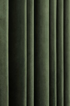 green velvet curtains are lined up in rows