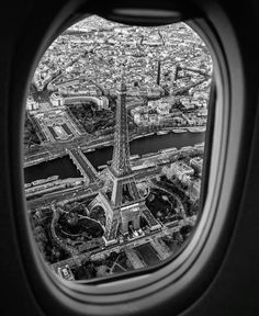 an aerial view of the eiffel tower in paris, france taken through an airplane window