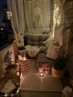 a living room filled with lots of furniture and candles on top of the rugs