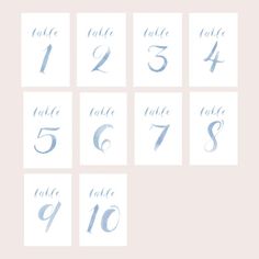 the table numbers are drawn in blue ink on white paper, and each number has an individual's name