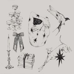 an ink drawing of various items including candles, wine glasses and a cat with stars on it