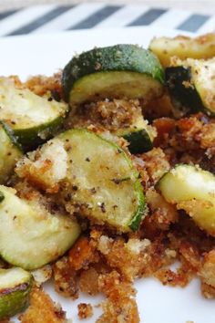 cooked vegetables on a plate with seasoning sprinkled over them, ready to be eaten