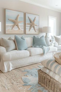 a living room filled with white couches and pillows