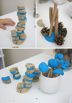 there are several pictures of different things made out of wood and blue paint on the table