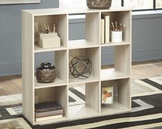 Socalle Nine Cube Organizer EA1864-3X3 Multi-Room Storage By ashley - sofafair.com Restful Bedrooms, Cube Bookcase, Cube Organizer, Ashley Furniture Homestore, Simple Silhouette, Cube Storage, High Quality Furniture, Ashley Furniture, At Home Store