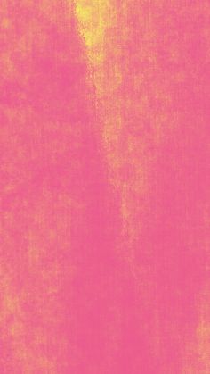 an orange and pink background with some sort of textured material in the foreground